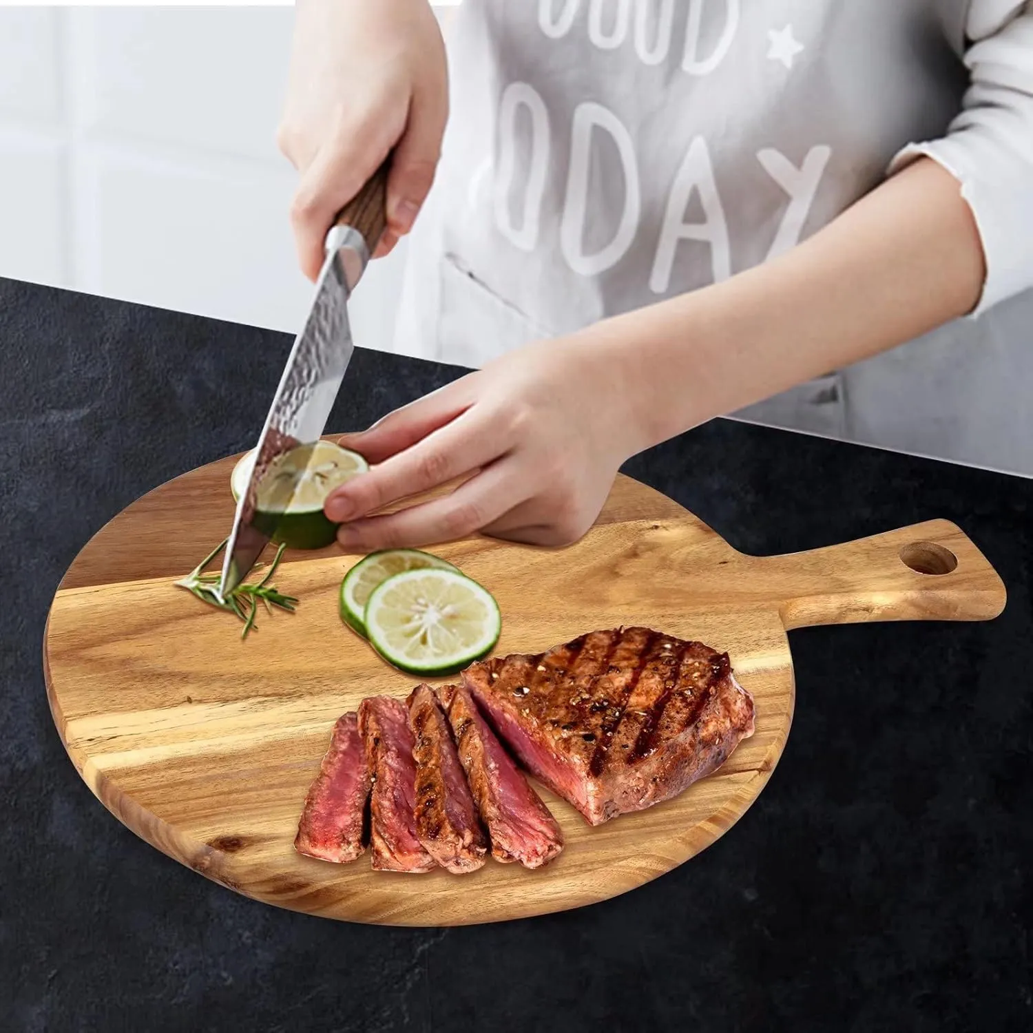 The wooden tone Round Wooden Chopping Board Natural Wood Cutting Board with Handle