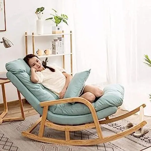 The wooden tone rocking chair for relaxation seating use made from solid wood and cushion