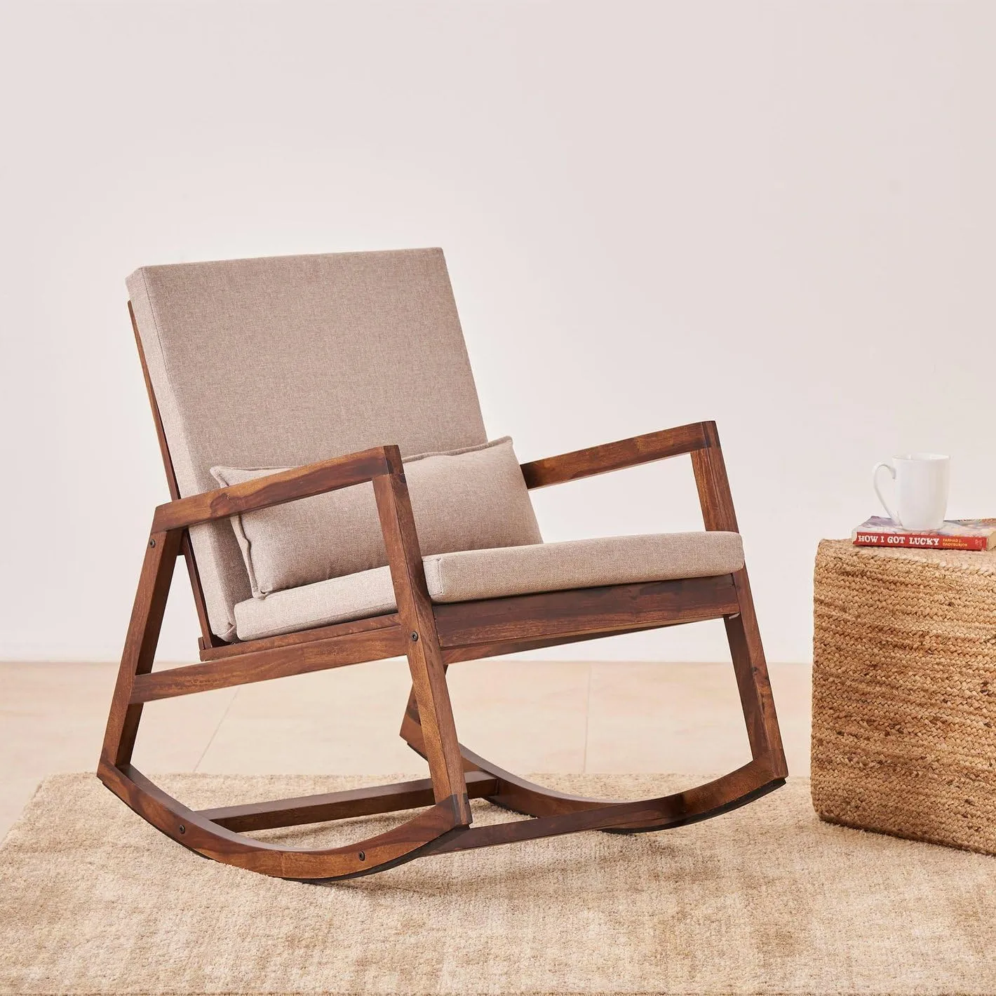 The wooden tone chair with cushion for living room and balcony relaxing use made with solid wood offers comfortable seating solution