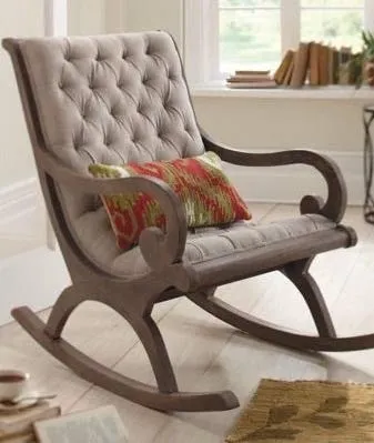 The wooden tone rocking chair for living room crafted from wood with soft cushion for daily relaxation comfort