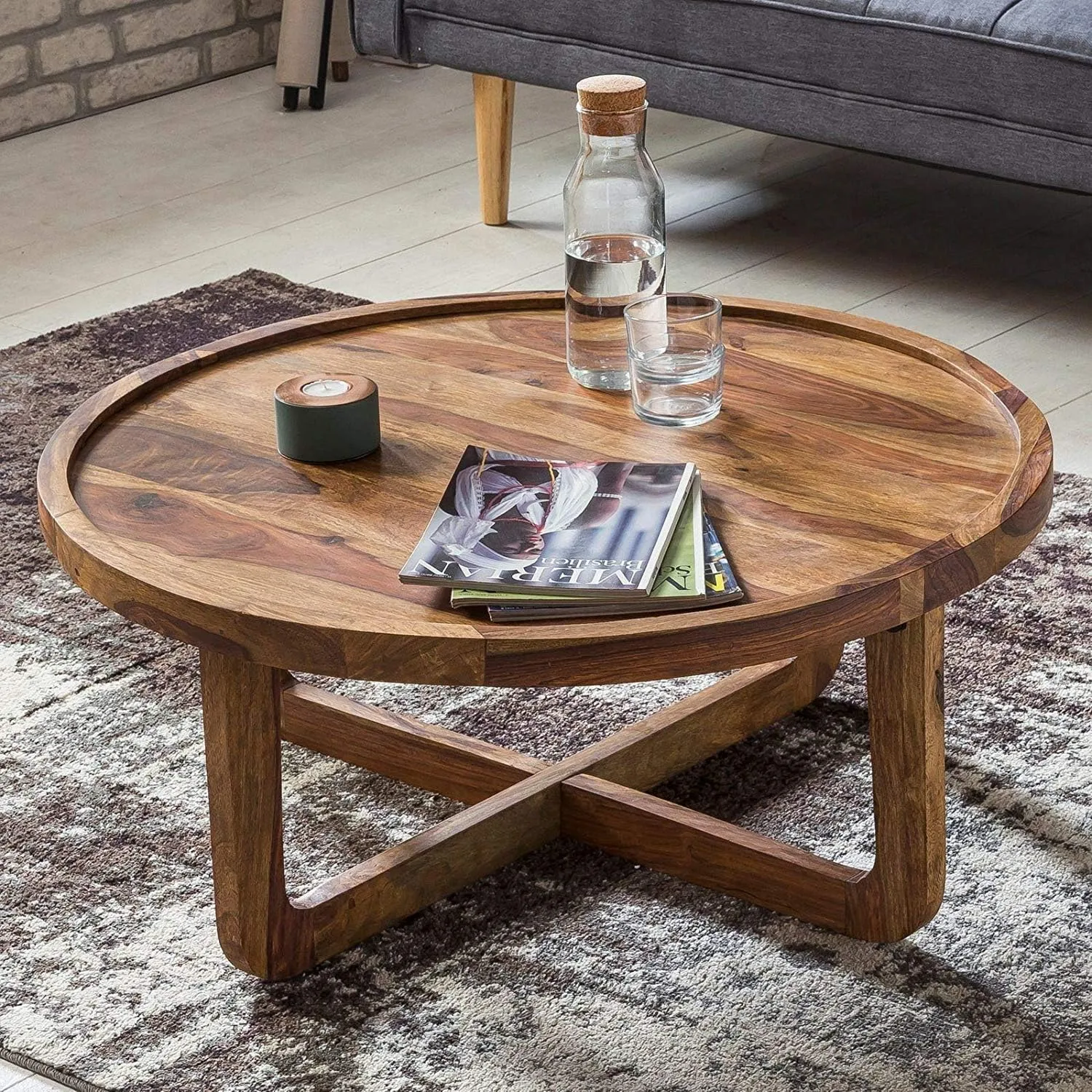 The wooden tone coffee table for living room use made from solid wood with storage design
