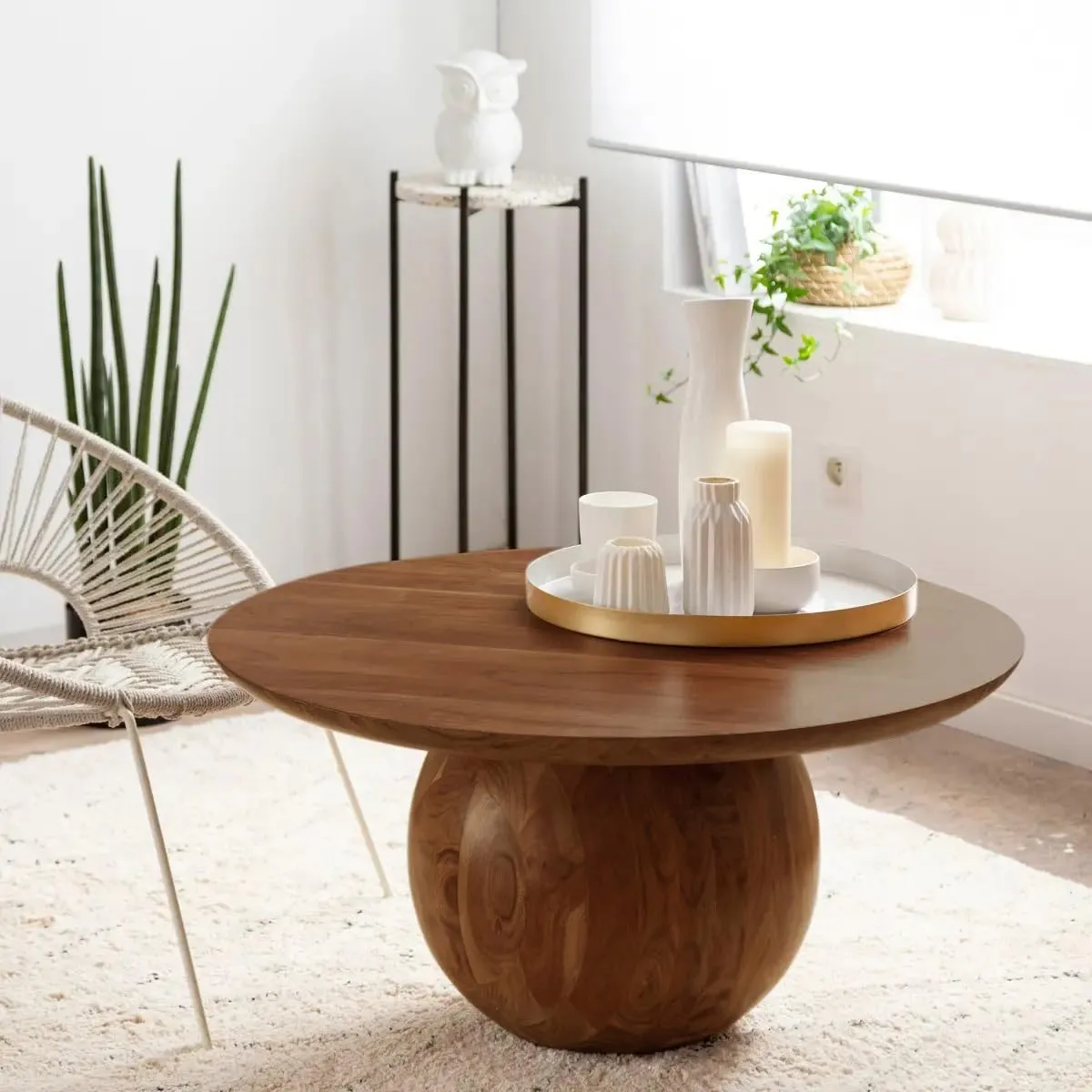 The wooden tone coffee table for living room use crafted from solid wood in light brown finish