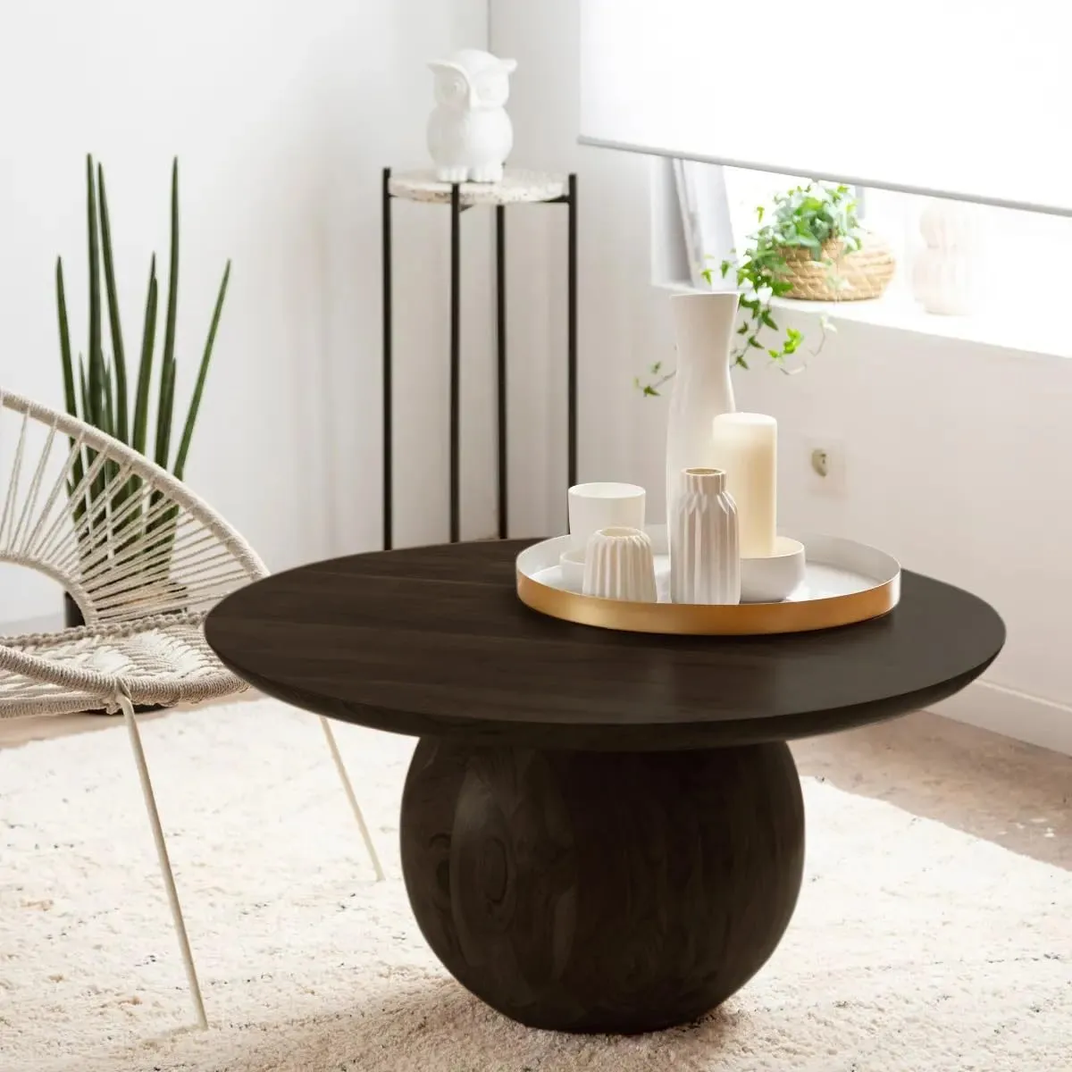 The wooden tone coffee table for living room use crafted from solid wood in black finish