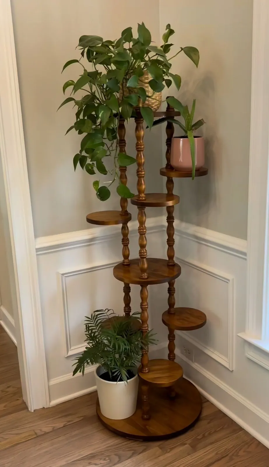 The wooden tone planter stand for home balcony use crafted from wood in brown light foldable design