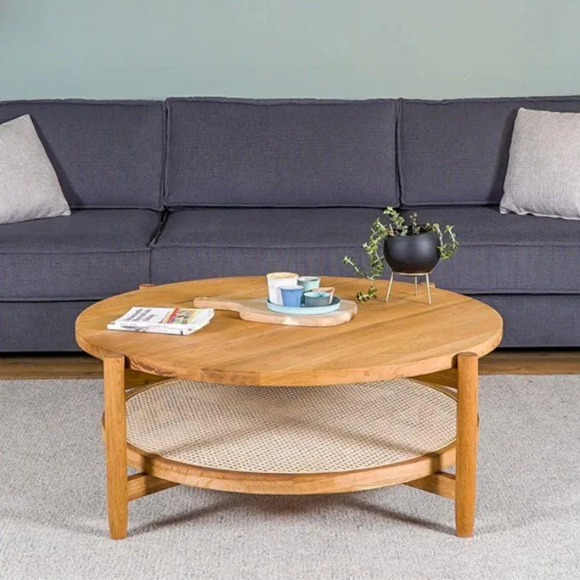 The wooden tone coffee table for living room use crafted from wood and cane with natural walnut finish