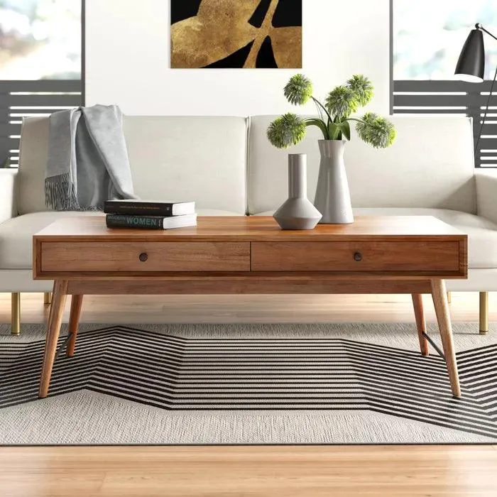 The wooden tone coffee table for living room use crafted from mango wood with drawers in brown finish