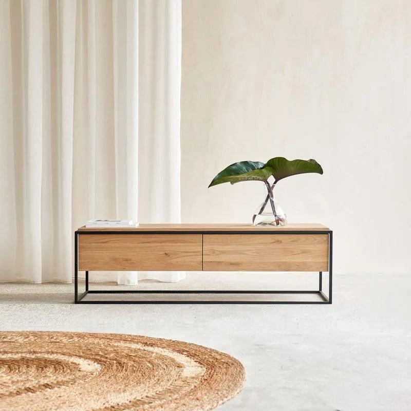 The wooden tone center table for living room use crafted from mango wood and iron with drawers in natural and black finish