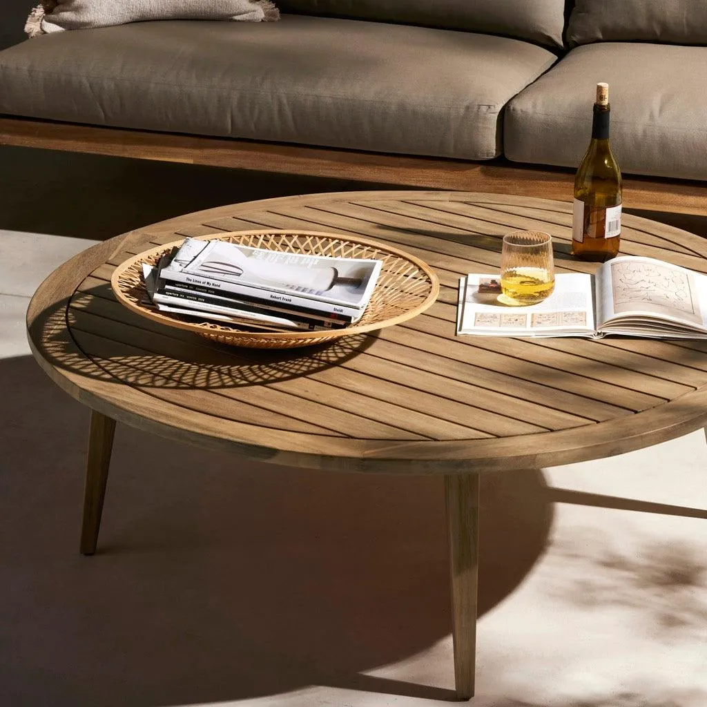 The wooden tone coffee table for living room use crafted from solid mango wood in natural finish