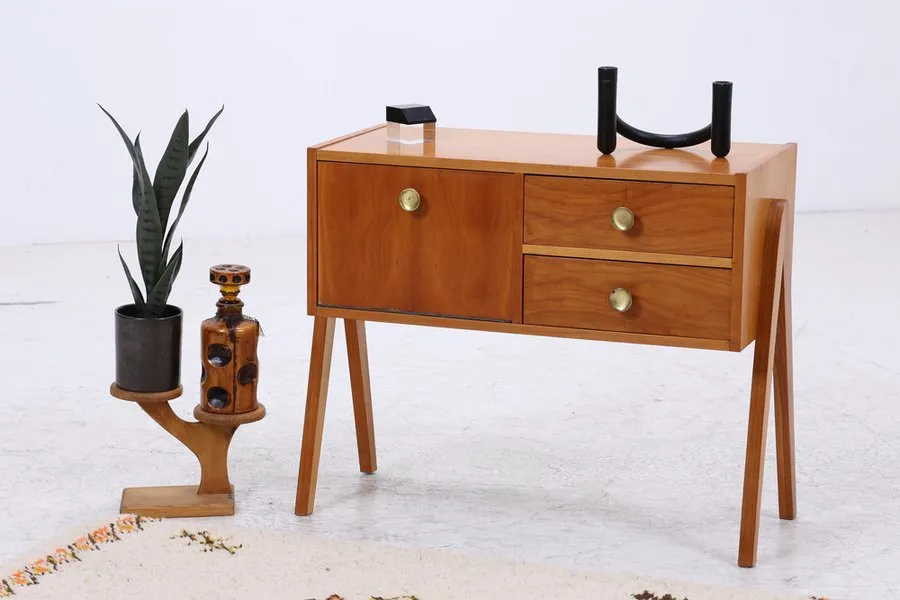 The Wooden Tone Bedside Table with flap and drawers in brown color crafted from wood for bedroom storage and daily use