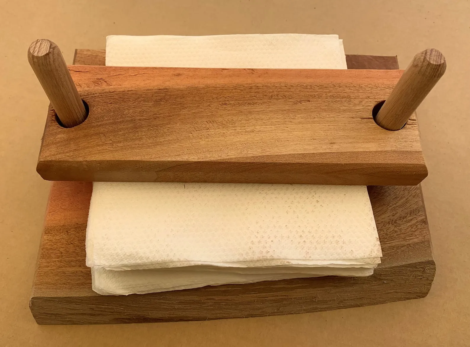 The Wooden Tone Napkin holder for table top use made from wood in light brown color for kitchen and dining organization