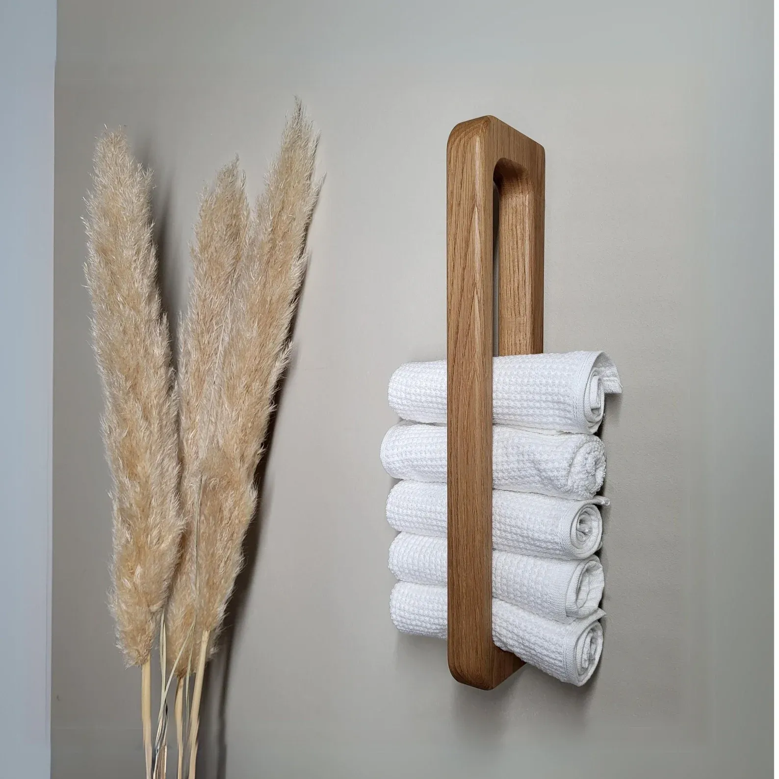 The wooden tone towel holder for daily use made from solid wood keeps towels organized with natural style