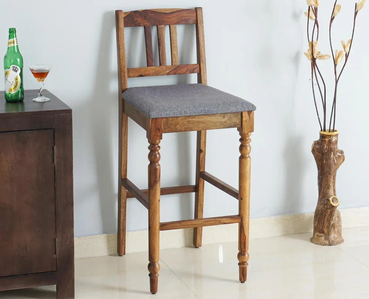 The Wooden Tone Wood Bar Chair with Cushion for Seating Use Made with Wood in Teak Finish Light Color