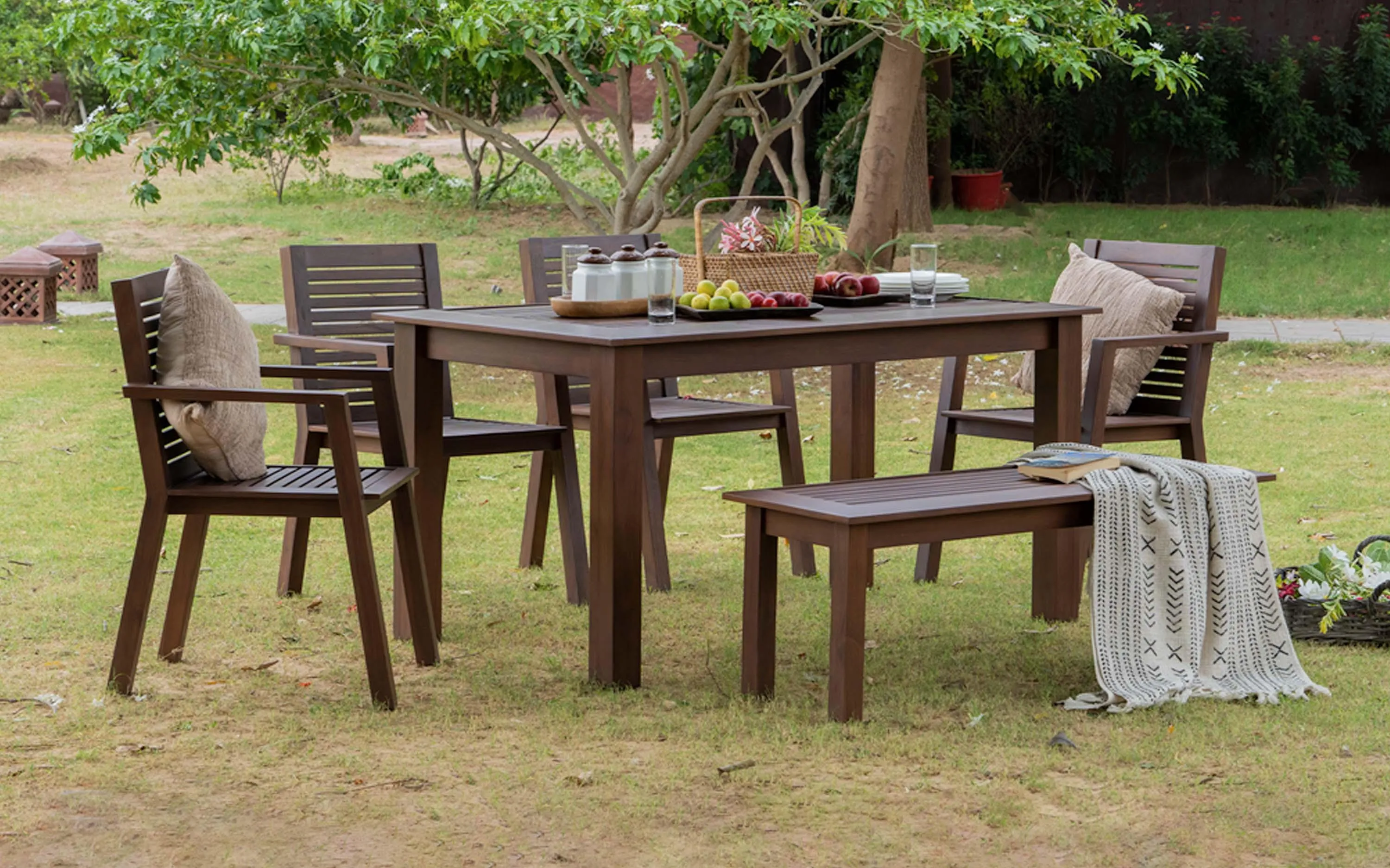 The Wooden Tone Dining Table with 4 Arm Chairs and Bench for Dining Use Made with Wood in Teak Brown Mahogany Light Color