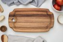 Brown wooden round chopping board with juice groove, natural wood cutting board