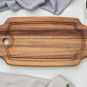 Brown wooden round chopping board with juice groove, natural wood cutting board