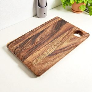 Natural mango wood chopping board with smooth finish and rustic grain pattern, perfect for cutting and serving in the kitchen.